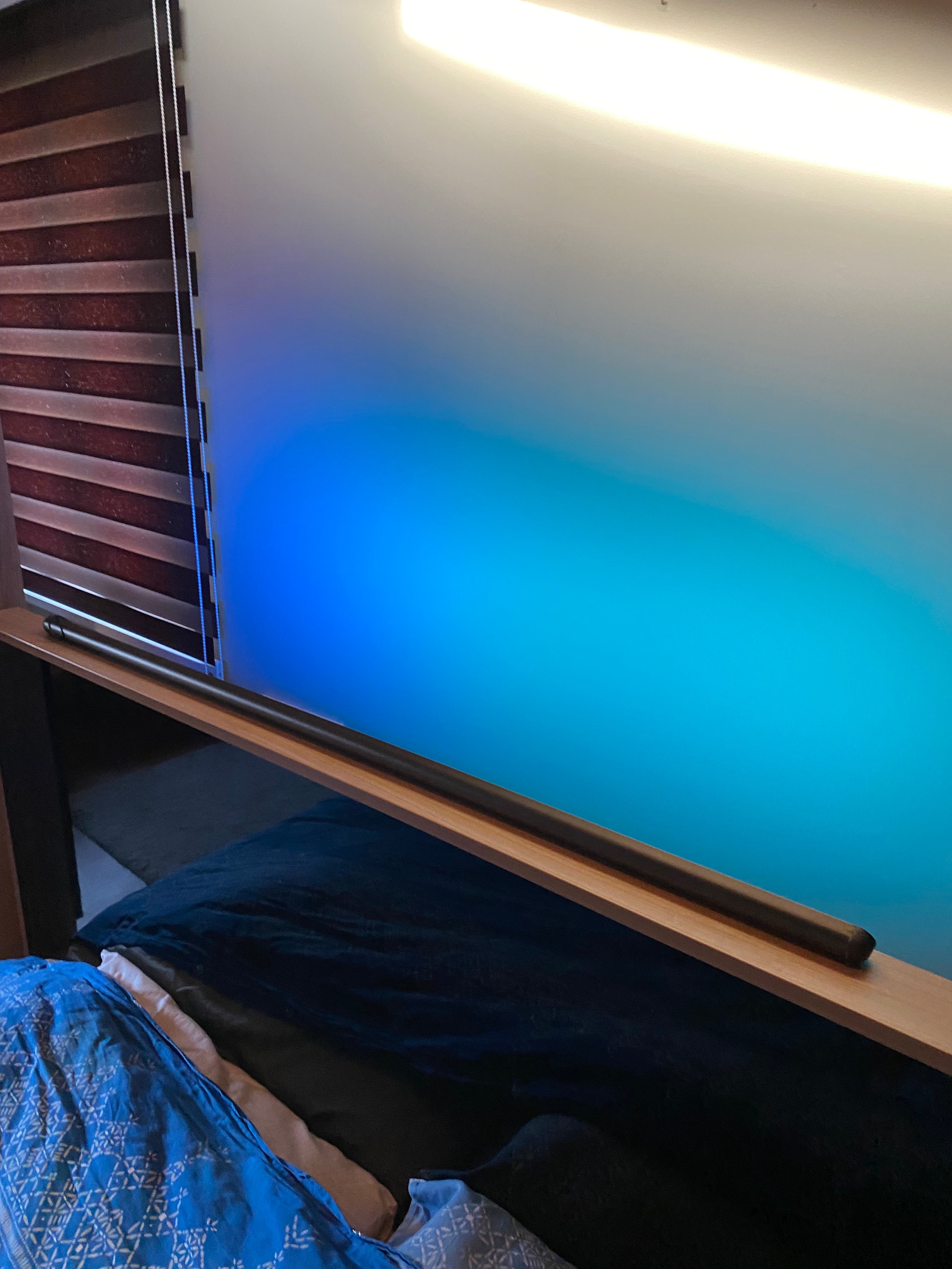 Customer scene: horizontal blue light above the headboard